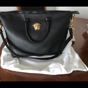 Authentic Medusa Versace handbag with straps.